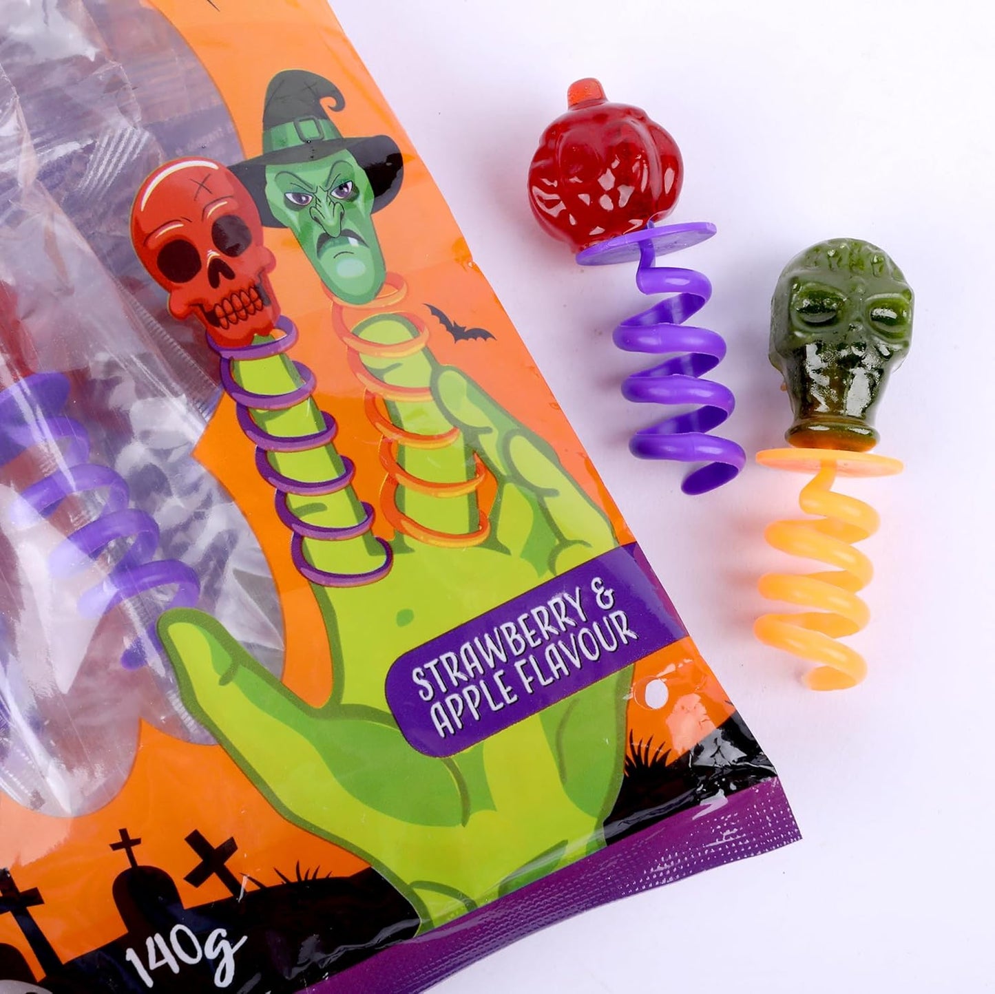 Jumpy Pops Halloween Lollies 140g – Sucettes sucrées en forme de tête de mort & sorcière avec ressort à enrouler autour des doigts – Cadeaux de fête, Trick or Treat, anniversaire & bonbons déco